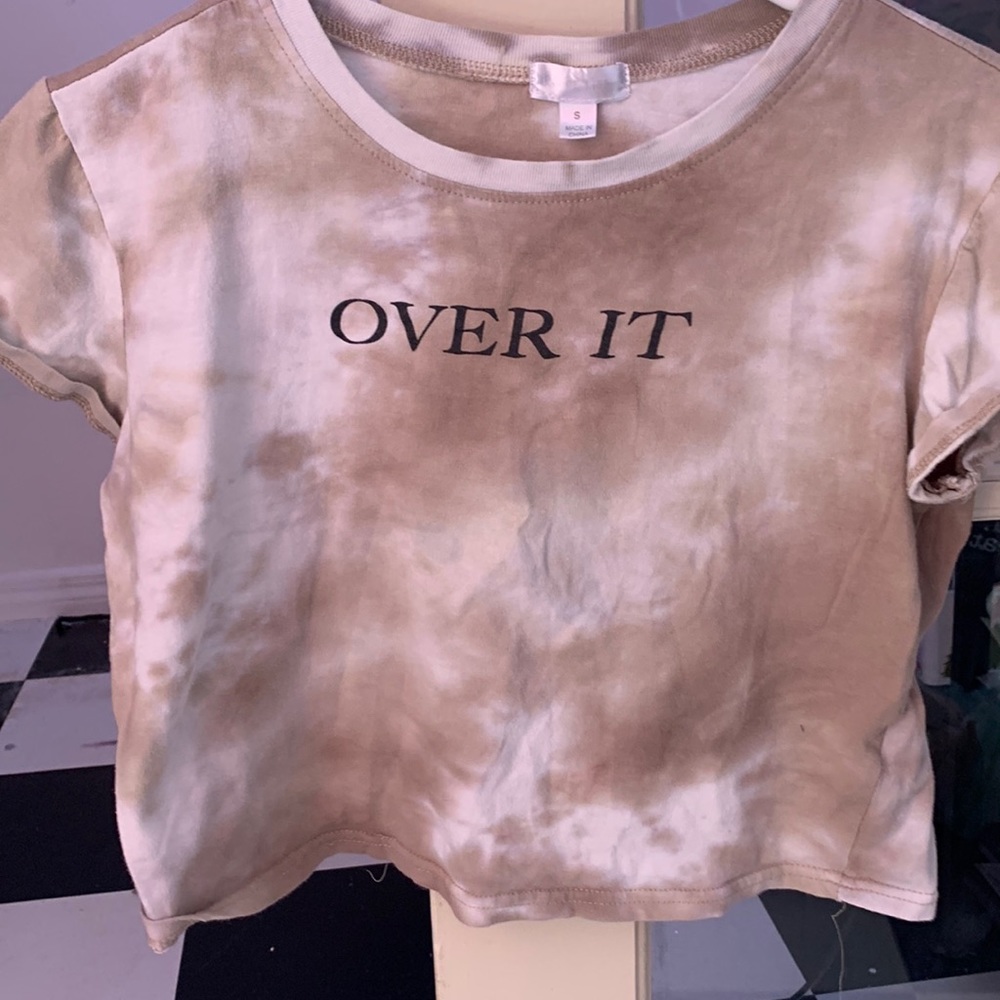 I am selling a over it shirt with butterfly’s in the back